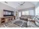 Spacious Gathering room with sectional sofa and large TV at 2040 Hickory Station Cir, Snellville, GA 30078