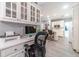 Bright kitchen features white cabinets, workspace, and island at 2040 Hickory Station Cir, Snellville, GA 30078