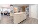 Kitchen boasts an island, white cabinets, and hardwood floors at 2040 Hickory Station Cir, Snellville, GA 30078