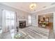 Living room with fireplace, hardwood floors and lots of light at 2040 Hickory Station Cir, Snellville, GA 30078
