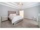 Main bedroom features plush bed and ceiling fan at 2040 Hickory Station Cir, Snellville, GA 30078