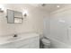 Clean bathroom with white vanity, toilet, and shower/tub combo at 2815 Windrush Dr, Buford, GA 30518