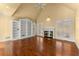 Living room with hardwood floors, fireplace, and built-in shelving at 2815 Windrush Dr, Buford, GA 30518