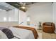 A loft bedroom features an open ceiling and an accent chair at 195 Arizona Ne Ave # 158, Atlanta, GA 30307