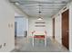 Simple dining area with concrete floors and modern pendant light at 195 Arizona Ne Ave # 158, Atlanta, GA 30307