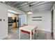 Modern dining area featuring a white table, orange chairs, and industrial-style ceiling and lighting at 195 Arizona Ne Ave # 158, Atlanta, GA 30307