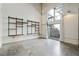 Modern living room featuring concrete floors, custom shelving, and view to the courtyard at 195 Arizona Ne Ave # 158, Atlanta, GA 30307