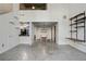 Open floor plan with metal ceiling design, concrete floors, shelves and kitchen view at 195 Arizona Ne Ave # 158, Atlanta, GA 30307