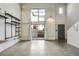 Modern living room featuring concrete floors, shelving, and large windows that allow natural light at 195 Arizona Ne Ave # 158, Atlanta, GA 30307