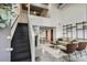 Bright living room with open floor plan, concrete floors, and metal staircase leading to loft area at 195 Arizona Ne Ave # 158, Atlanta, GA 30307