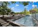 Pool and hot tub deck with lounge chairs, table and chairs with view of pool at 195 Arizona Ne Ave # 158, Atlanta, GA 30307