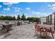 Well appointed roof deck with dining tables and seating overlooking treeline at 195 Arizona Ne Ave # 158, Atlanta, GA 30307