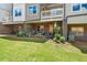 Ground level patio with grass, plants, and a seating area at 279 Commons Ave, Woodstock, GA 30188