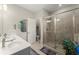 Elegant bathroom with double vanity, large shower, and modern fixtures at 279 Commons Ave, Woodstock, GA 30188