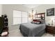 Cozy bedroom with a queen-size bed and large window at 279 Commons Ave, Woodstock, GA 30188