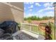 Relaxing deck with grill, plants, and view of developing landscape at 279 Commons Ave, Woodstock, GA 30188