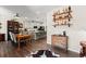 Open concept dining room with farmhouse table and kitchen views at 279 Commons Ave, Woodstock, GA 30188