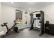 Home gym with Peloton bike and weight machine at 279 Commons Ave, Woodstock, GA 30188