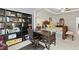 Main bedroom features a built-in office space with bookshelves and desk at 279 Commons Ave, Woodstock, GA 30188