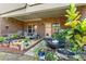 Relaxing patio with seating area, fountain, and lush landscaping at 279 Commons Ave, Woodstock, GA 30188