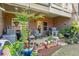 Brick patio with seating area, fountain, and lush landscaping at 279 Commons Ave, Woodstock, GA 30188