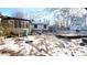 Large backyard with shed and patio area, partially covered in snow at 2982 Cruse Rd, Lawrenceville, GA 30044