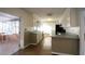 Kitchen features white cabinets and sunlit breakfast area at 2982 Cruse Rd, Lawrenceville, GA 30044