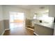 Kitchen with white cabinets and view of breakfast area at 2982 Cruse Rd, Lawrenceville, GA 30044