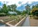 Landscaped community garden with raised beds and greenhouse at 314 Pepperwood Way, Canton, GA 30114