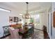 Bright dining room with a rustic wooden table and access to backyard at 314 Pepperwood Way, Canton, GA 30114