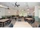 Bright dining room with multiple tables and chairs, perfect for gatherings at 314 Pepperwood Way, Canton, GA 30114