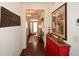 Hallway with red cabinet and artwork leading to the living area at 314 Pepperwood Way, Canton, GA 30114