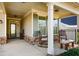 Inviting front porch with rocking chairs and stone accents at 314 Pepperwood Way, Canton, GA 30114