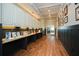 Hallway with hardwood floors, workspaces, and display cases at 314 Pepperwood Way, Canton, GA 30114