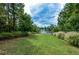 Scenic view of a lake with lush green landscaping at 314 Pepperwood Way, Canton, GA 30114