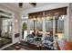 Bright sunroom with wicker chairs and view of backyard at 314 Pepperwood Way, Canton, GA 30114