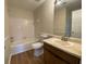 Clean bathroom with tub, toilet and vanity at 8263 Canyon Forge Dr, Riverdale, GA 30274