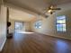 Spacious living room with hardwood floors, fireplace and sliding glass doors at 8263 Canyon Forge Dr, Riverdale, GA 30274