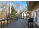 Wooden deck with a grill and view of the backyard at 103 Ashwood N Ct, Stockbridge, GA 30281