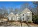 Two-story house with gray siding, dark roof, and landscaping at 103 Ashwood N Ct, Stockbridge, GA 30281