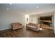 Open living room and kitchen with hardwood floors at 103 Ashwood N Ct, Stockbridge, GA 30281