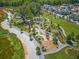 Aerial view of a community park with playground, walking paths and open green spaces at 130 Rolison Way, Fayetteville, GA 30214