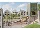 Wooden playground with climbing structures and slides, near residential homes at 130 Rolison Way, Fayetteville, GA 30214