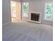 Living room with fireplace, neutral walls, carpet, and doors to outside deck at 2482 Northlake Ct, Atlanta, GA 30345