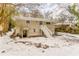 Back of house with stairs and snow covered yard at 2792 Plantation Dr, Atlanta, GA 30344