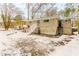Back of house with stairs and snow covered yard at 2792 Plantation Dr, Atlanta, GA 30344