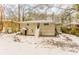 Back of house with stairs and snow covered yard at 2792 Plantation Dr, Atlanta, GA 30344