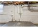 Unfinished basement with exposed utilities and pipes at 2792 Plantation Dr, Atlanta, GA 30344