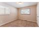 Well-lit bedroom with carpet and window coverings at 2792 Plantation Dr, Atlanta, GA 30344