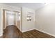 Dining area with vinyl flooring and view into living room and entryway at 2792 Plantation Dr, Atlanta, GA 30344